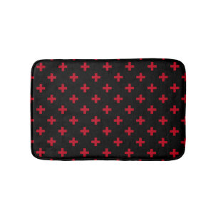 Rote Polka-Kreuze auf schwarz Badematte