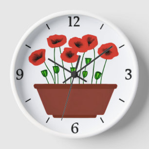 Rote Popkuchen in einem Terracotta Planter Uhr