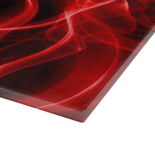Rote Rauchwolken auf schwarz Schneidebrett (Ecke)