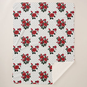 Rote Rosen auf einem Polka Dot Hintergrund. Sherpadecke