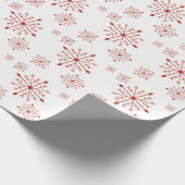 Rote Schneeflocken im Weißbuch Geschenkpapier (Ecke)