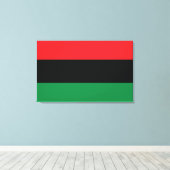 Rote, Schwarze und Grüne Flagge Leinwanddruck (Insitu (Holzboden))