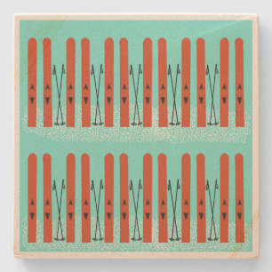 Rote Skier auf blauem Untersetzer