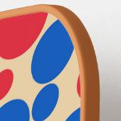 Rote und blaue Punkte auf Tan Pickleball Schläger (Linke Seite)