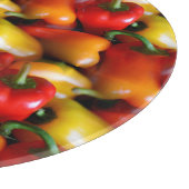 Rote und gelbe Paprikaschoten Schneidebrett (Ecke)
