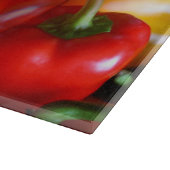 Rote und gelbe Paprikaschoten - Schnittplatine Schneidebrett (Ecke)