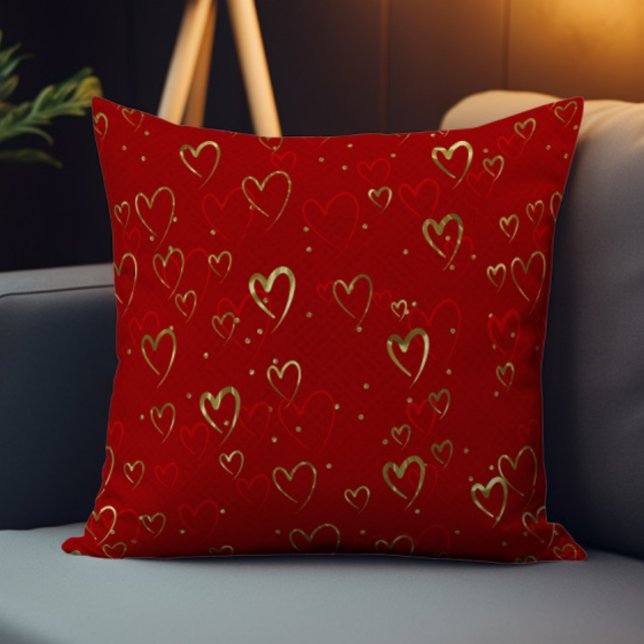 Rote und goldene Herzen auf rotem Valentinstag-Mus Kissen (Von Creator hochgeladen)
