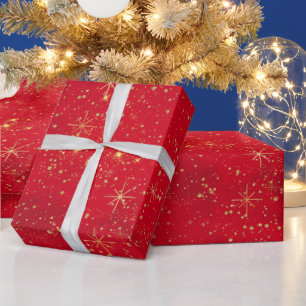 Rote und goldene Weihnachtssterne und Glittermuste Geschenkpapier