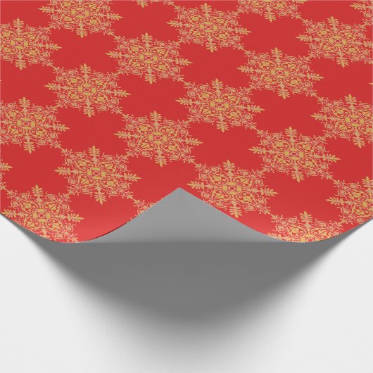 Rote und goldfarbene verzierte Brokatquadrate Geschenkpapier (Ecke)