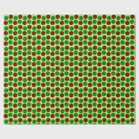 Rote und grüne Urlaubspunkte auf hellgrün Geschenkpapier (Flach)