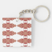 Rote und orangefarbene Blütengestaltung mit Ziergr Schlüsselanhänger (Rückseite)