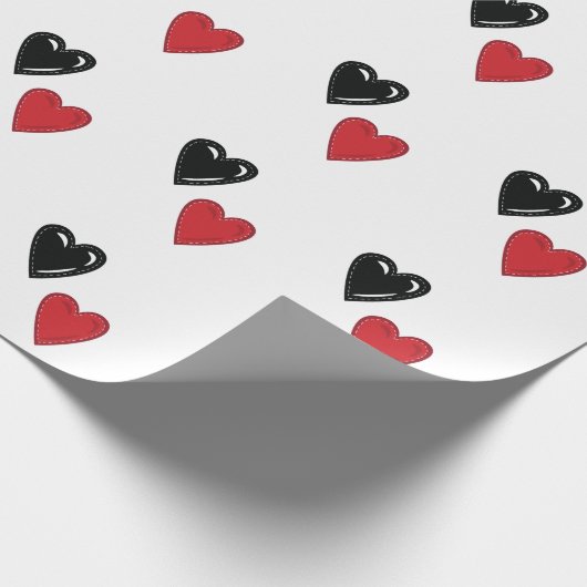 Rote und schwarze Valentinhöre auf Weiß Geschenkpapier (Ecke)