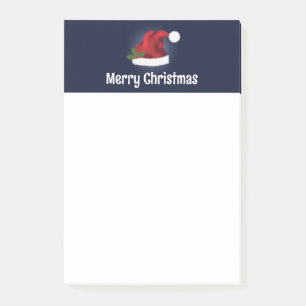 Rote Weihnachtsmannmütze mit Weihnachtsholz und in Post-it Klebezettel