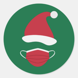 Rote Weihnachtsmannmütze und Gesichtsmaske Runder Aufkleber