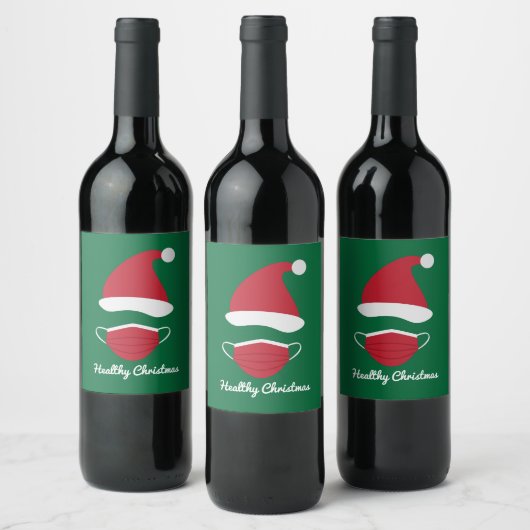 Rote Weihnachtsmannmütze und Gesichtsmaske Weinetikett (Flaschen)
