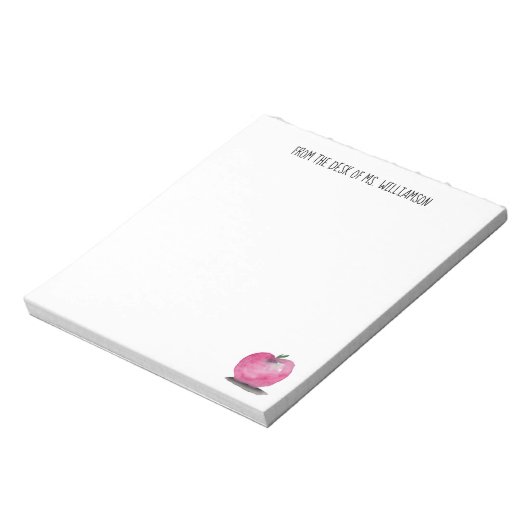 Roter Apfel aus dem Schreibtisch des Lehrers Notizblock (Rotiert)