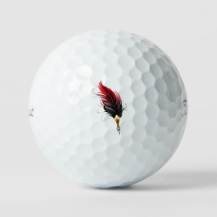 Roter Federhalter mit Goldfeder Golfball