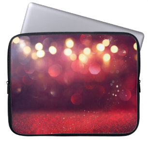 Roter Glitter Vintage-Lichter Hintergrund. unschar Laptopschutzhülle