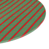 Roter grüner Weihnachtsstrumpf auf Grün Schneidebrett (Ecke)