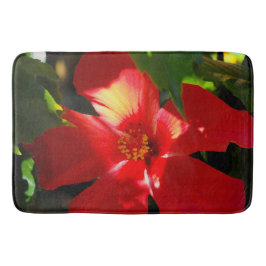 Roter Hibiskus Blume bei Sonnenlicht Badematte