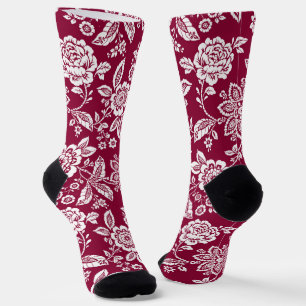 Roter Hintergrund mit weißer Blüte Socken