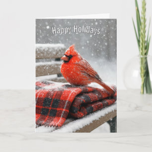 Roter Kardinal an Weihnachten auf einer schneebede Karte