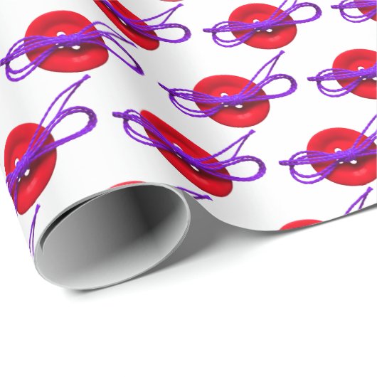 roter Knopf mit lila Bogen Geschenkpapier (Rolleneckpunkt)