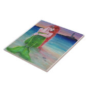 Roter Kopfdiener am Strand mit Leuchtturm. Fliese (Seite)