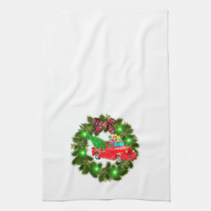 Roter Lkw, der durch einen Weihnachtskranz fährt Geschirrtuch