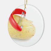 Roter Peeler, der Kartoffel auf weißem Hintergrund Keramikornament (Links)