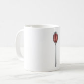 Roter Sirup in Silberlöffel Kaffeetasse (Vorderseite Links)