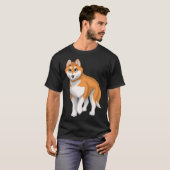 Roter und weißer sibirischer Husky-Hund mit blauen T-Shirt (Vorne ganz)