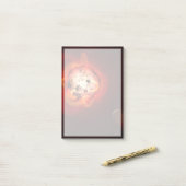 Roter Zwergstern, der von einem hypothetischen Exo Post-it Klebezettel (Auf Schreibtisch)