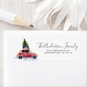 Rotes Auto mit Weihnachtsbaum-Rücksende-Adressetik (Insitu)