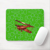 Rotes Bi-Flugzeug auf grünen Kreisläufen und Schle Mousepad (Mit Mouse)