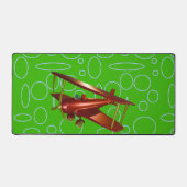 Rotes Bi-Flugzeug auf grünen Kreisläufen und Schle Schreibtischunterlage (Vorderseite)