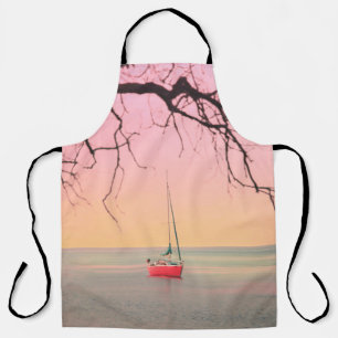 ROTES BOOT AM STRAND BEI SONNENUNTERGANG SCHÜRZE