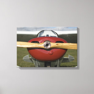 Rotes Flugzeug und hölzerner Propeller Leinwanddruck