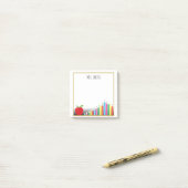 Rotes gefärbtes Apple zeichnet eine Anmerkung vom Post-it Klebezettel (Auf Schreibtisch)