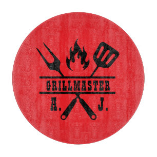 Rotes Grillmeister-Werkzeug  Schneidebrett
