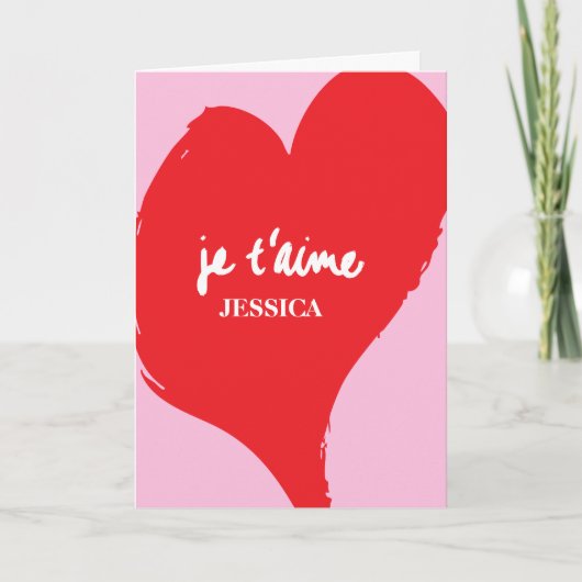 Rotes Herz mit je t’aime-Text auf rosa Hintergrund Karte (Vorderseite)