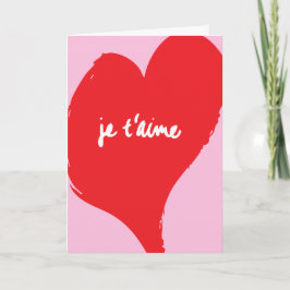 Rotes Herz mit je t’aime-Text auf rosa Hintergrund Karte