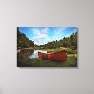 Rotes Kanu auf der Seebank Leinwanddruck