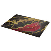 Rotes schwarzes Marmormuster mit Gold Schneidebrett (Ecke)