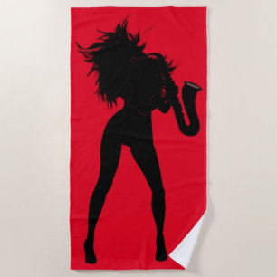 Rotes Strandtuch mit Saxophonistin Frau