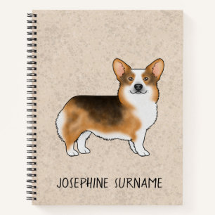 Rotköpfiger dreifarbiger Pembroke Welsh Corgi und Notizblock