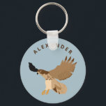 Rotschwanzfalken im Flug Personalisiert Schlüsselanhänger<br><div class="desc">Dieser Schlüsselanhänger zeigt einen roten Falken im Flug vor einem hellblauen Hintergrund und Ihren eigenen Namen oder Ihre kurze Nachricht. Finden Sie koordinierende Falken themed Geschenke und Produkte in der Hawk und Blackbird Kollektion von Asterisk Designs.</div>