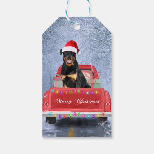 Rottweiler Hund im Schnee sitzend im Weihnachtswag Geschenkanhänger (Rückseite)