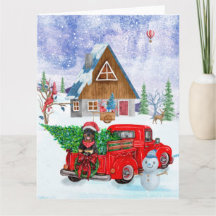 Rottweiler-Hund im Weihnachtslieferwagen Schnee Karte