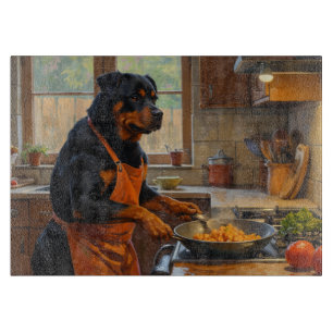 Rottweiler kocht in der Küche Schneidebrett